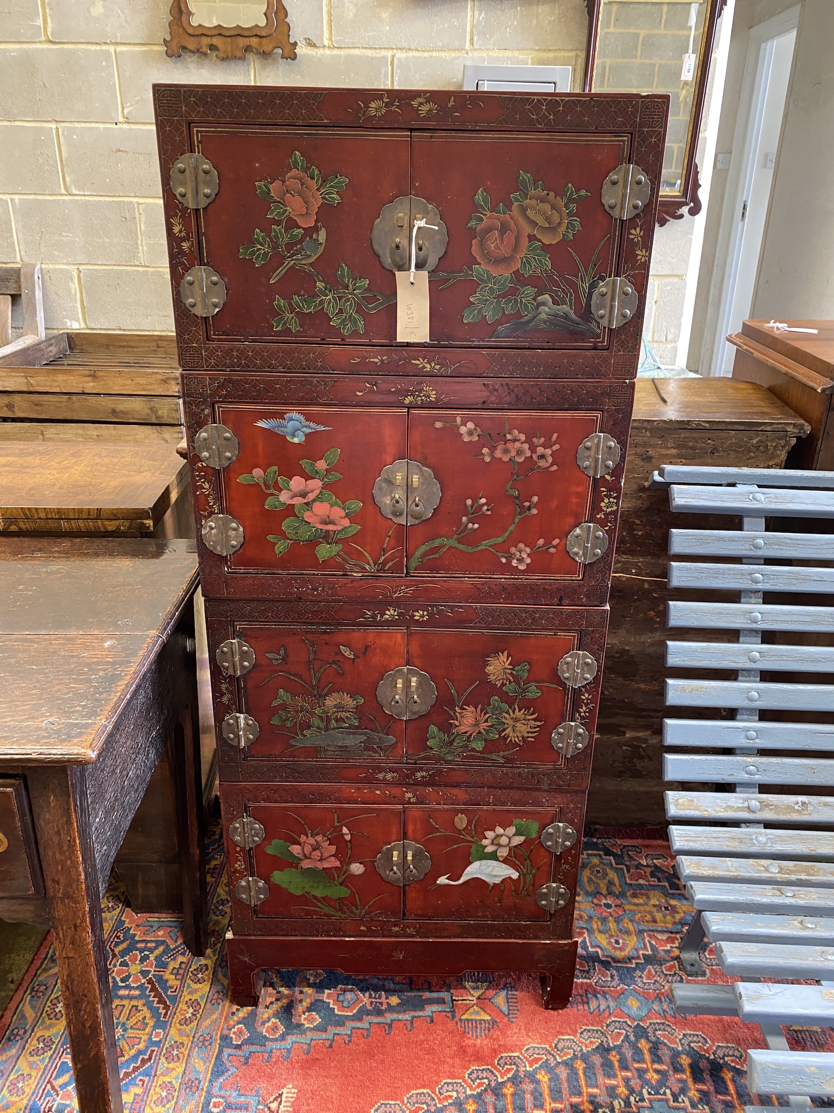A Chinese lacquer four section cabinet, width 51cm, depth 31cm, height 128cm